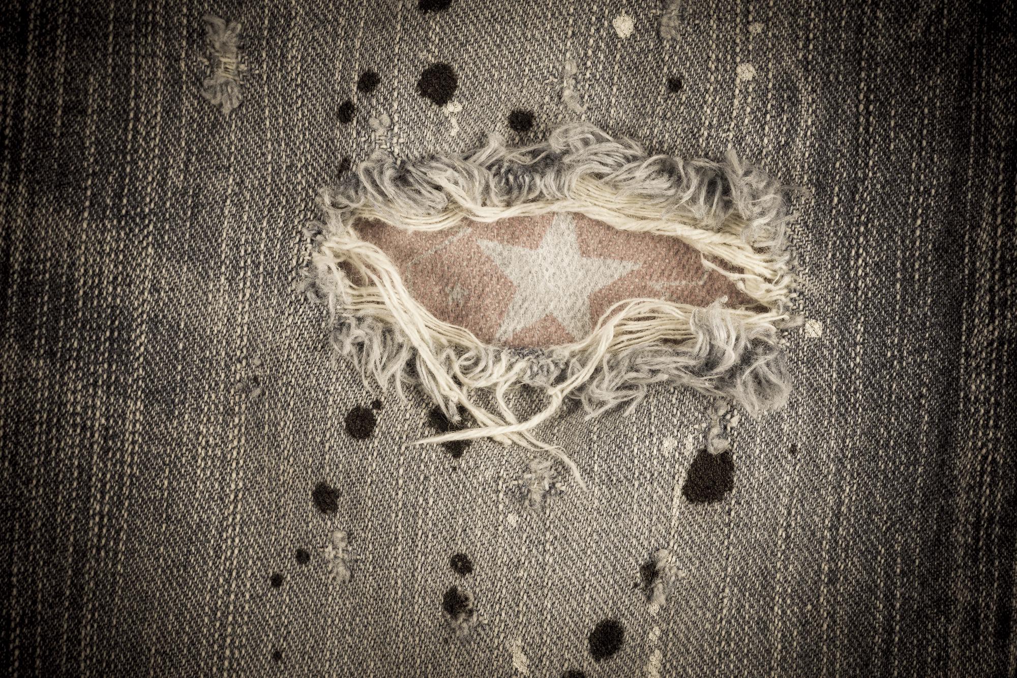 Worn embroidered textile with missing motifs